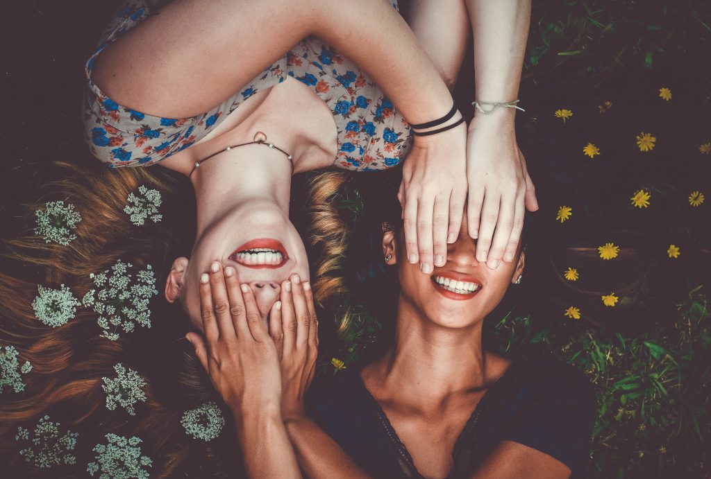 Two Girls Covering Each Others Eyes